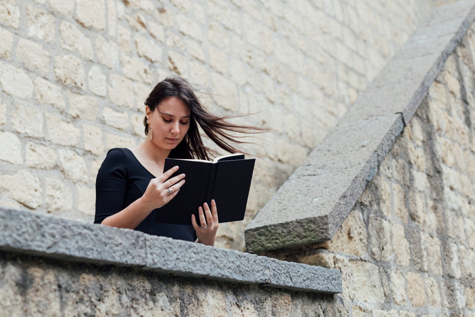 girl-reading-book-windy-day